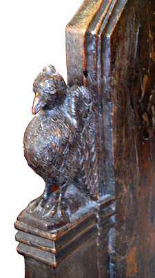 This carved bird adorns a pew end at Reepham, near Weston